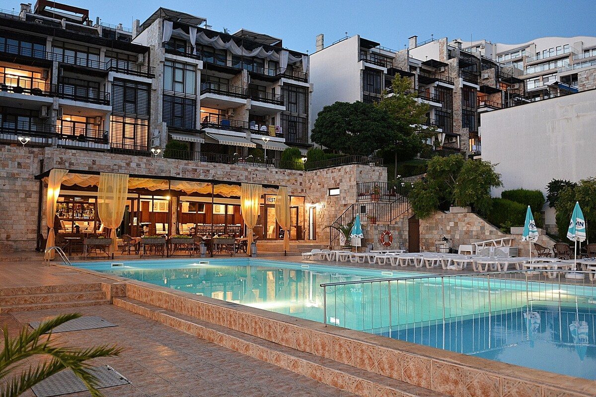 The complex and pool at dusk